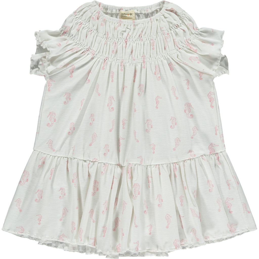 white dress with pink flower print smocked neck line short sleeves and large frill tier