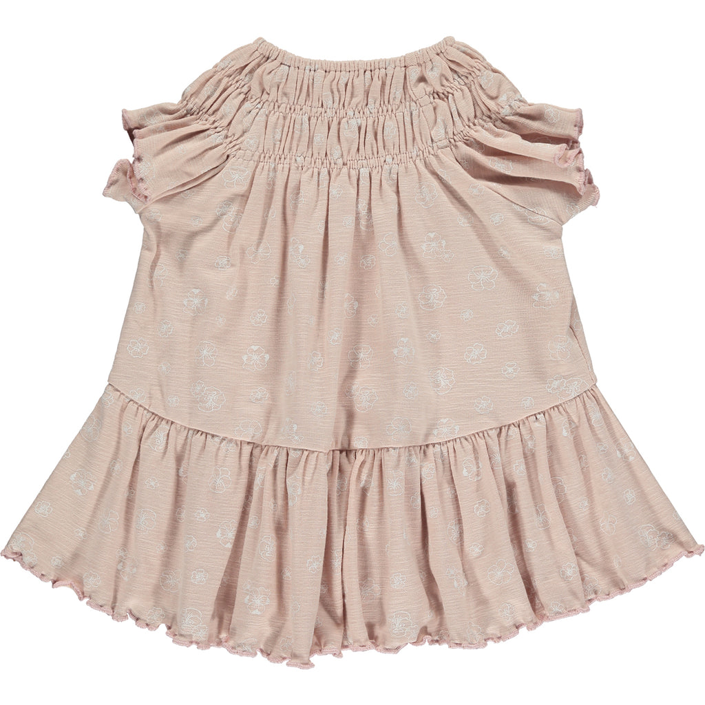 pale pink dress with white flower print smocked neck line short sleeves and large frill tier