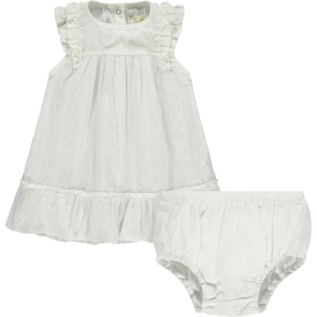 white dress in pretty cutout lace like fabric. Two layer frill sleeves and tier to hem line.matching diaper cover