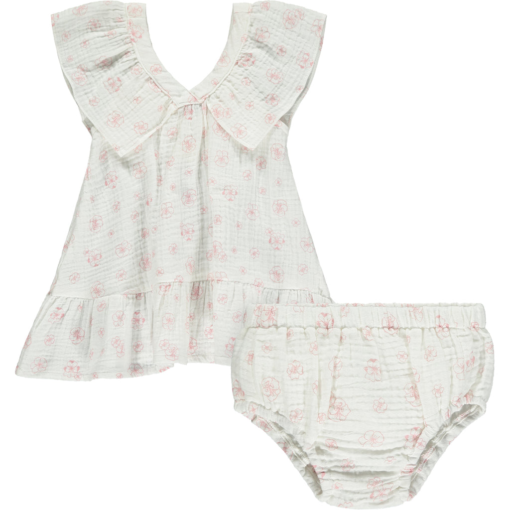 white gauze summer dress with pink flower print. Large over the shoulder frills and v neck front and back pictured with matching diaper cover pants