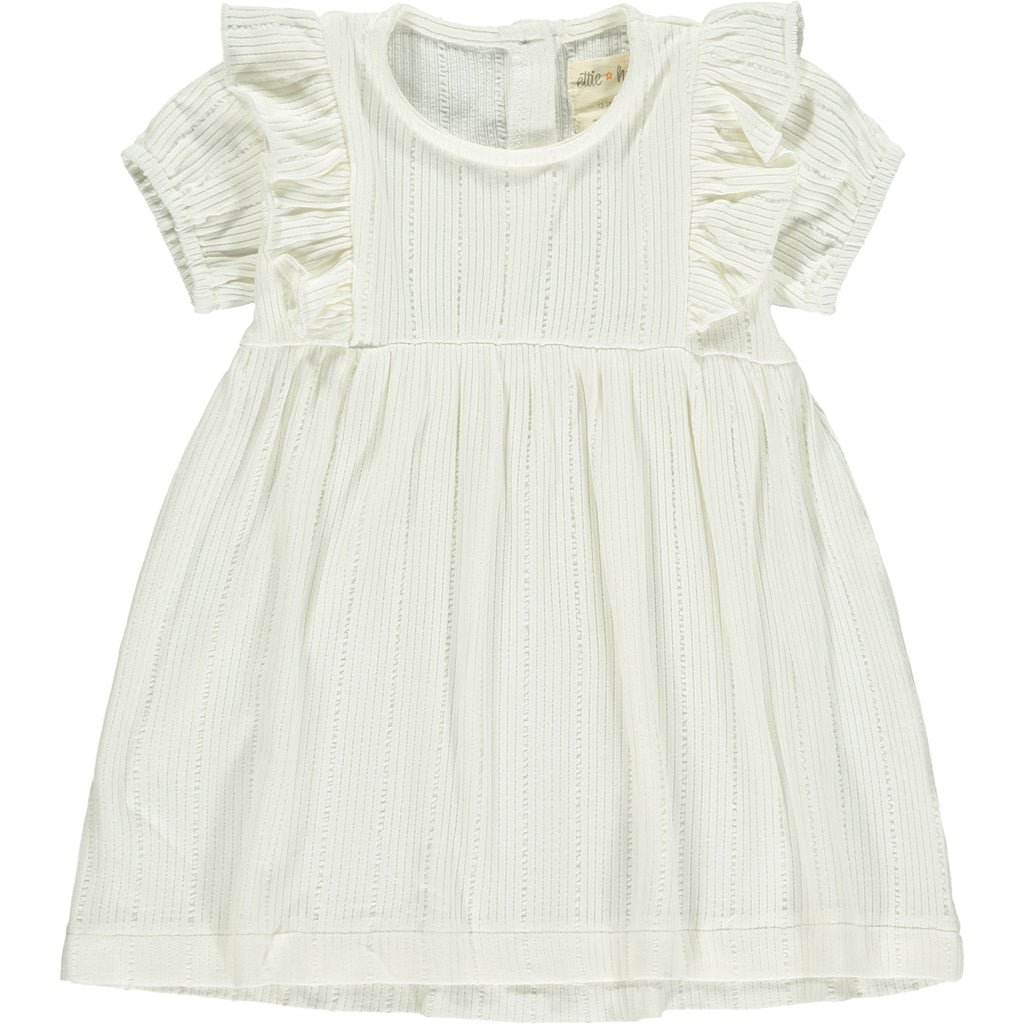 white dress with frill over shoulders and short sleeves line pattern fabric