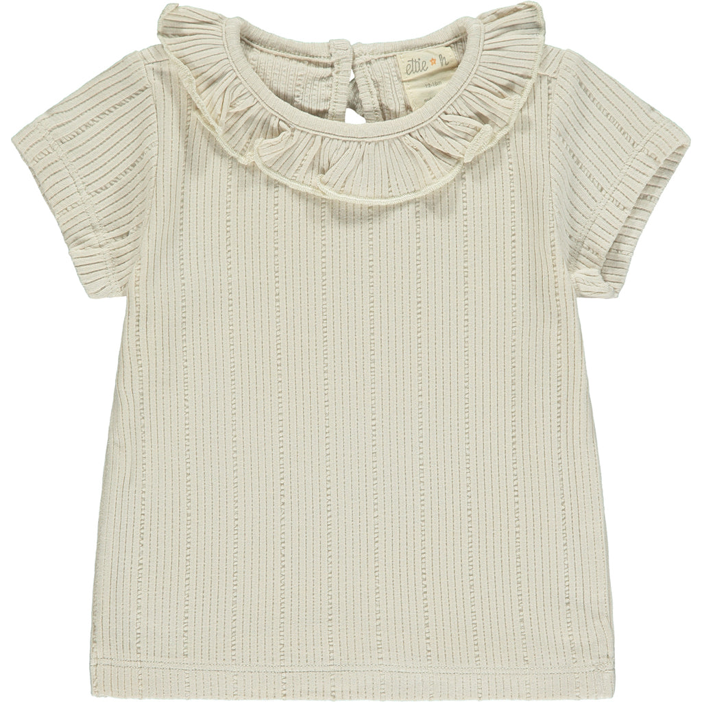 cream tee shirt with patterned fabric and frill neck
