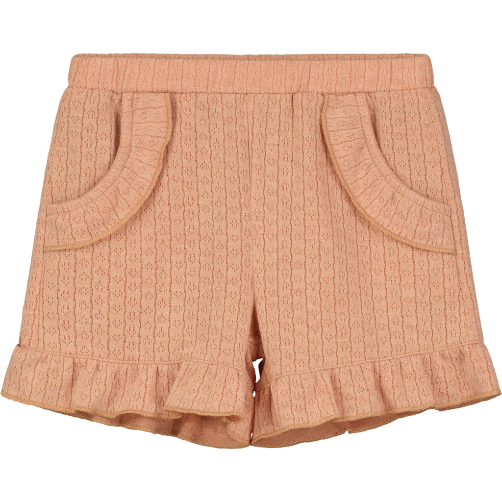 coral shorts in jersey pointelle fabric side pockets and frill around the legs