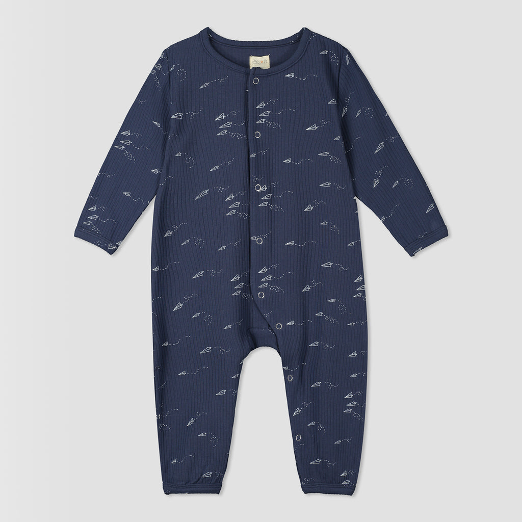 navy blue ribbed romper with rocket print. poppers down front