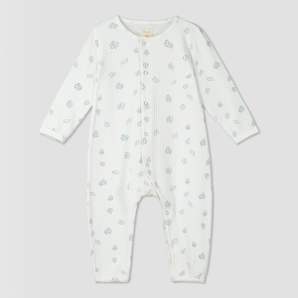 white ribbed romper with leaf print. poppers down front